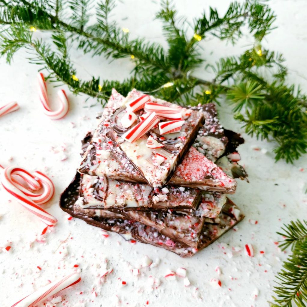 boozy peppermint bark stacked with crushed candy canes