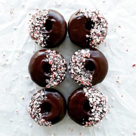 functional image chocolate donuts with peppermint schnapps glaze 6 donuts in 2 rows top down with crushed candy canes