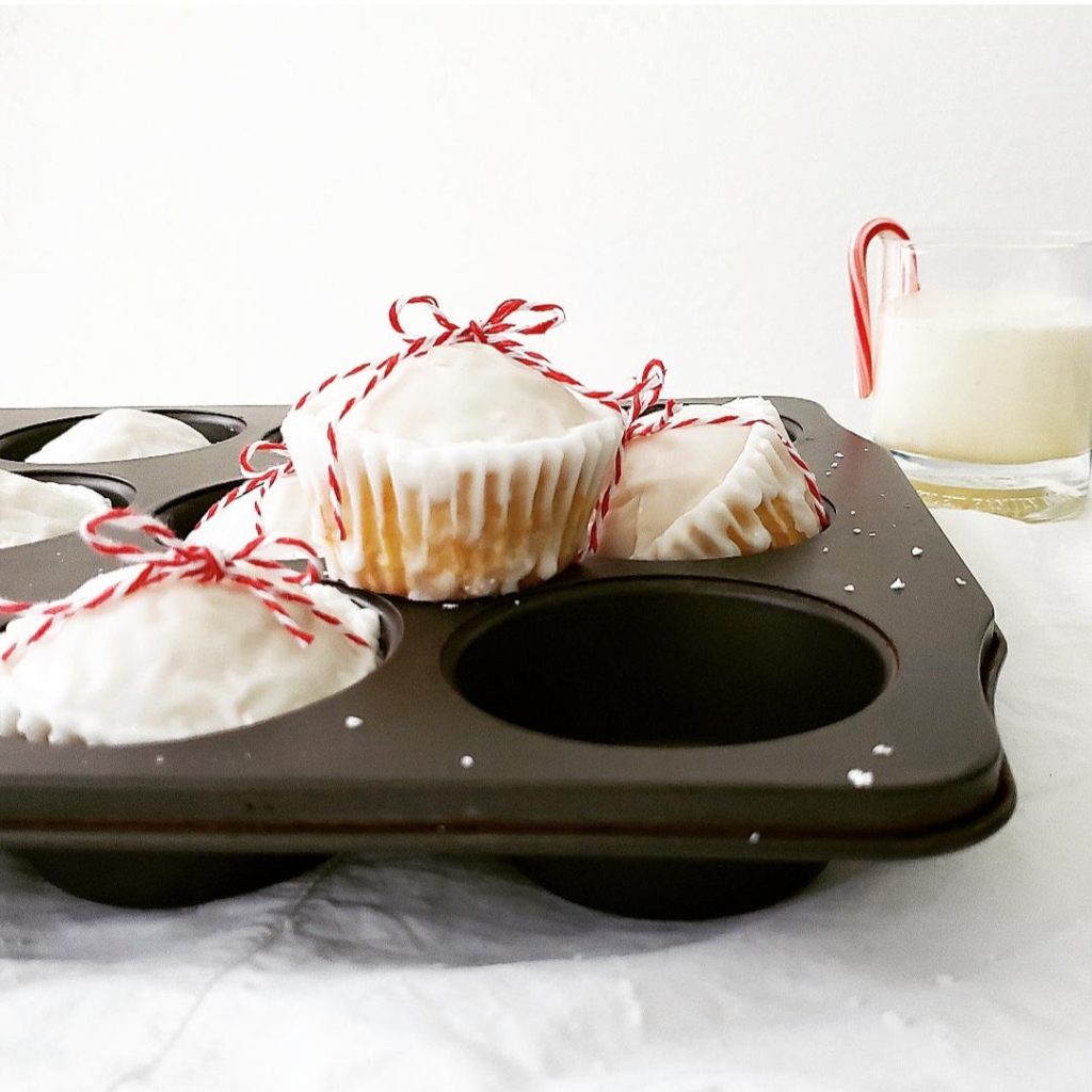 eggnog muffins recipe with eggnog glaze spiked with rum in a muffin pan 