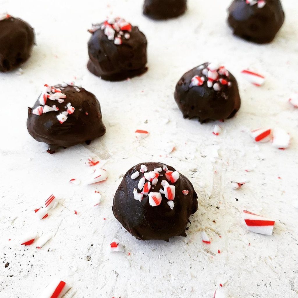 peppermint schnapps truffles with crushed candy canes on a white background