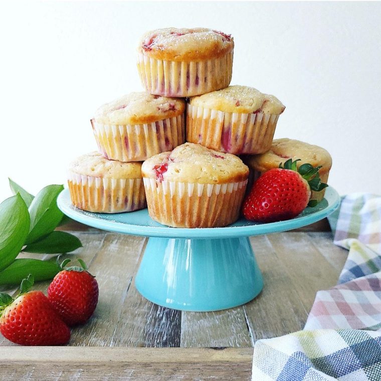 functional image strawberry shortcake muffins towering stack on a blue cake plate