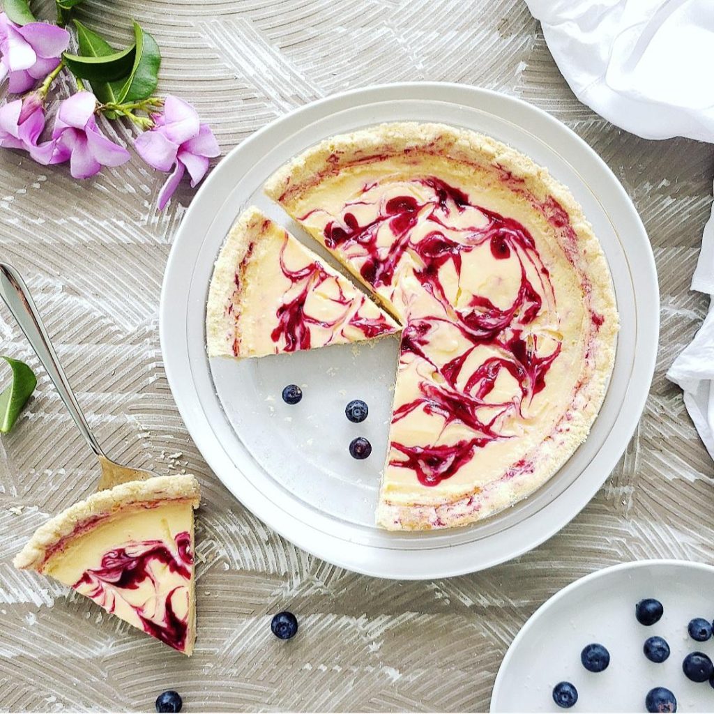 top down view of a lemon pie swirled with blueberry sauce in a glass pie dish lemon blueberry pie recipe