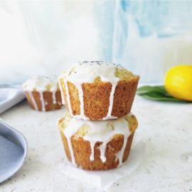 functional image lemon poppy seed muffins with lemon glaze bakery style muffins stacked 2 high