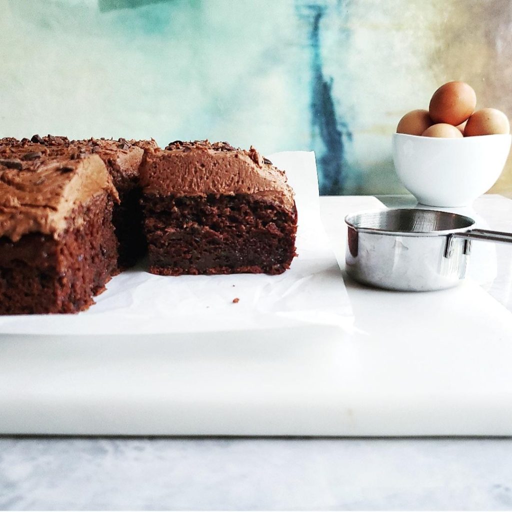 functional image chocolate cake zucchini chocolate buttercream bowl of brown eggs zucchini cake