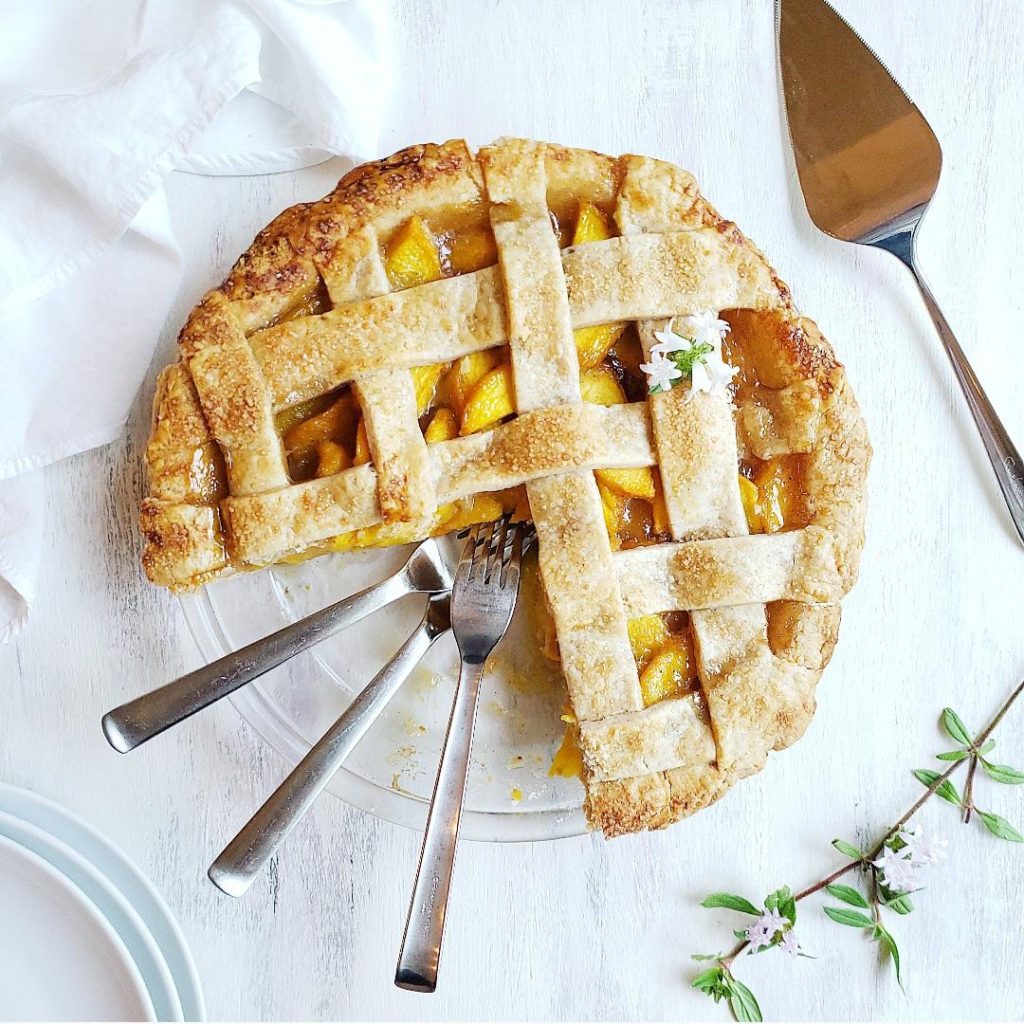 functional image recipe for peach pie cut pie rustic pie lattice forks fresh peach pie