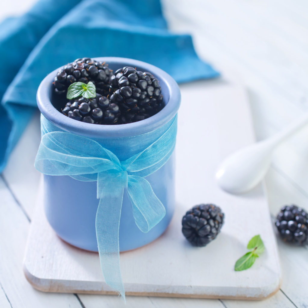 functional image blackberry muffins with oatmeal fresh blackberries in a light blue cup