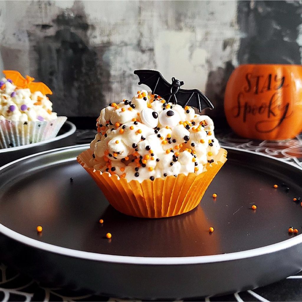 functional image halloween popcorn balls orange cupcake liner candy eyeballs and stay spooky in background