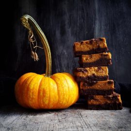 functional image pumpkin brownies small batch stacked with a pumpkin with a giant stem