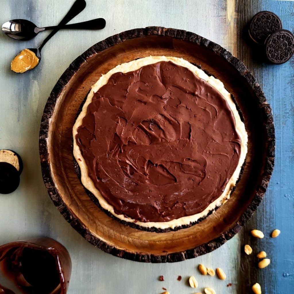functional image frozen peanut butter pie uncut with peanut butter oreo cookies