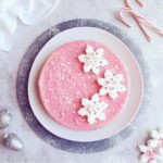 functional image pink peppermint cheesecake with snowflake marshmallows crushed candy canes top down photo winter wonderland scene