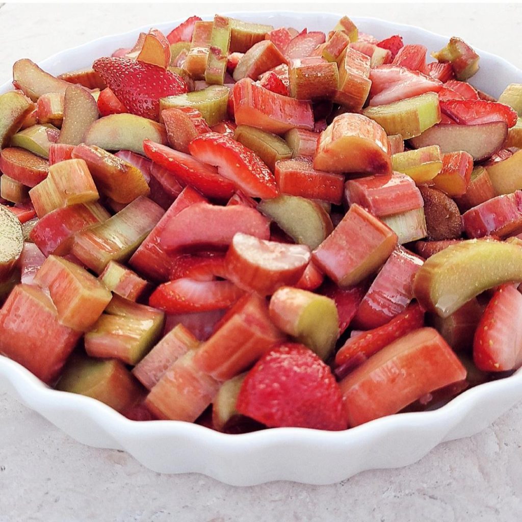 functional image strawberry rhubarb cobbler chopped fruit in baking dish