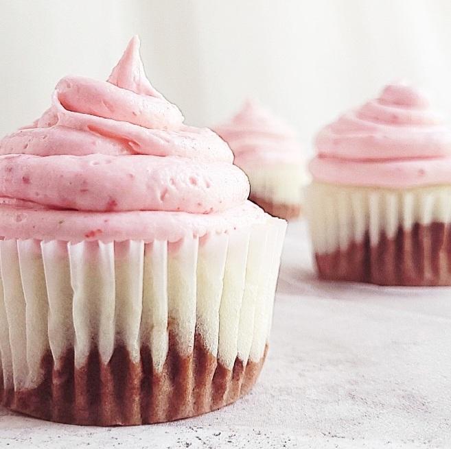 functional image closeup side view of neapolitan cupcakes chocolate vanilla and strawberry cupcakes with buttercream frosting