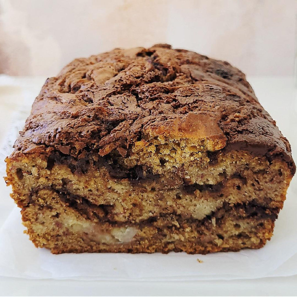 functional image nutella banana bread side view of sliced loaf close up 