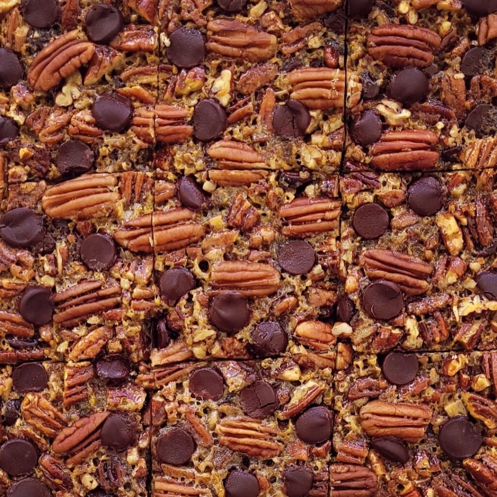 functional image chocolate chip pecan pie bars top down, zoomed in image of bars cut into squares