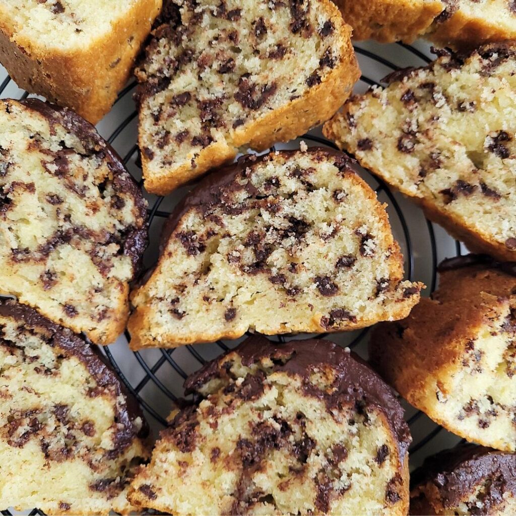 chocolate chip bundt cake. top down view of cut slices lying flat on a round wire baking rack. 