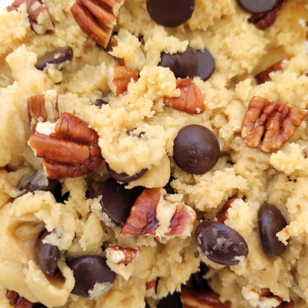 close up view of chocolate chip chopped pecan cookie dough